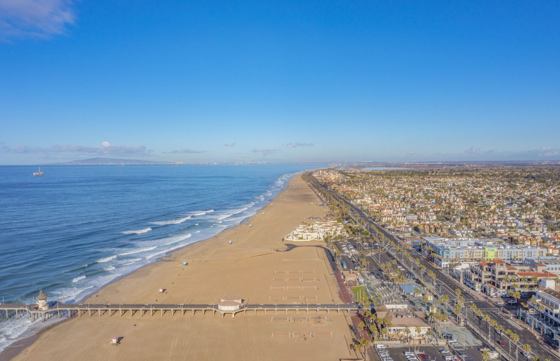 Aerial view of the Huntington Beach coastline and pier